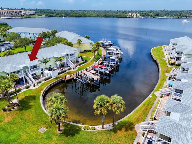 birds eye view of property featuring a water view