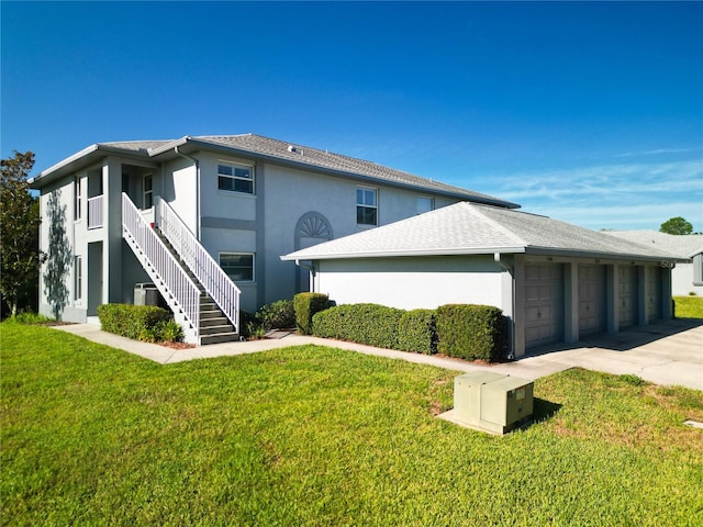 view of front of house with a garage and a front yard