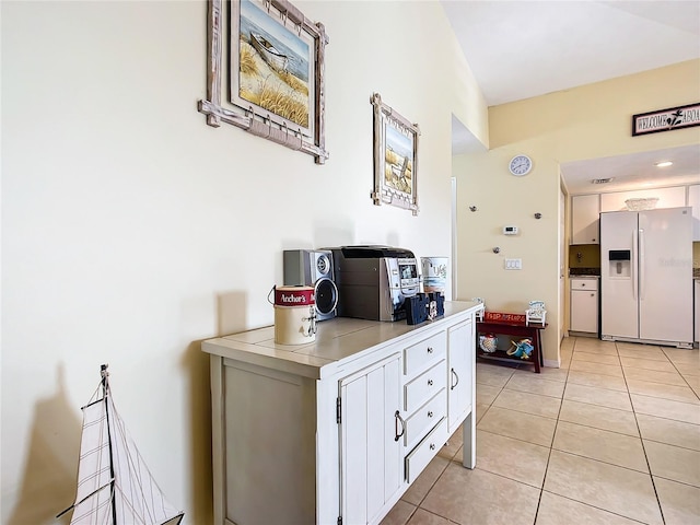 hallway with light tile patterned floors