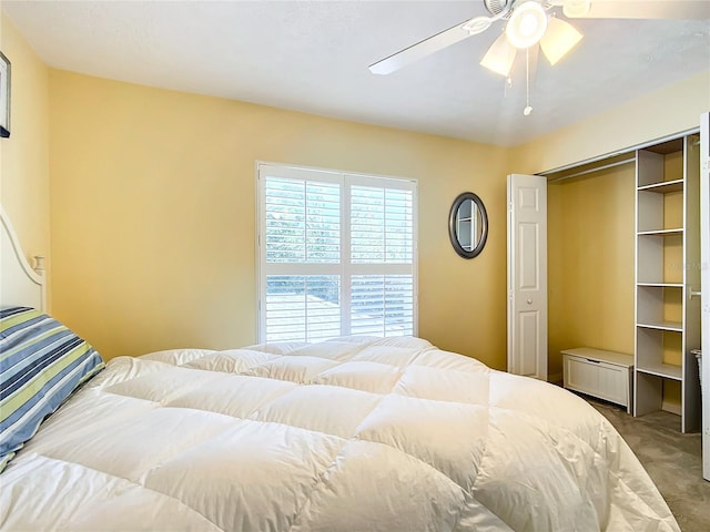 bedroom with a closet, light colored carpet, and ceiling fan