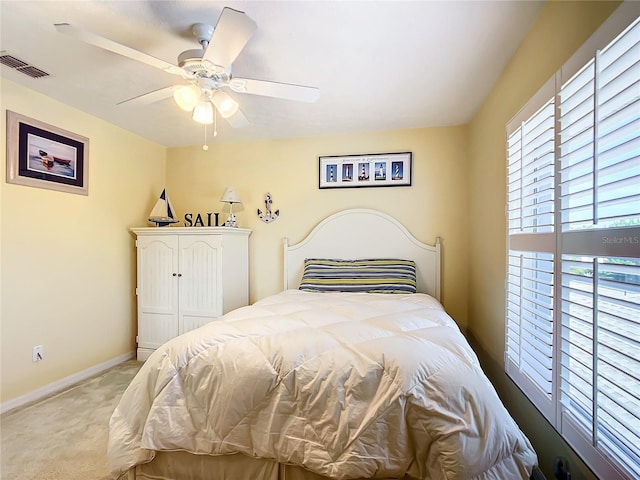 carpeted bedroom with ceiling fan