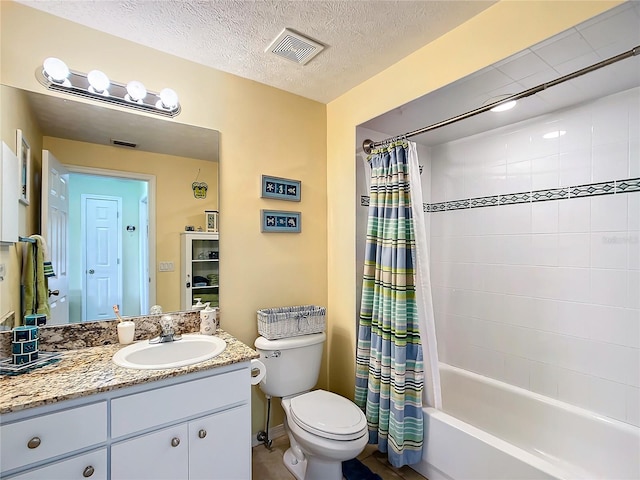 full bathroom featuring vanity, toilet, shower / bath combination with curtain, and a textured ceiling