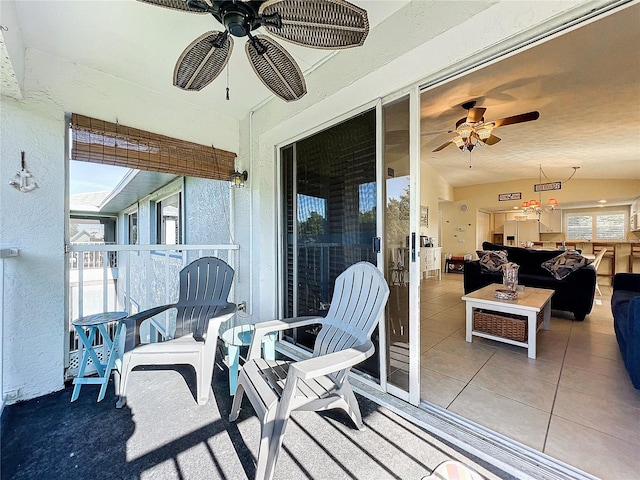 exterior space with ceiling fan and a patio