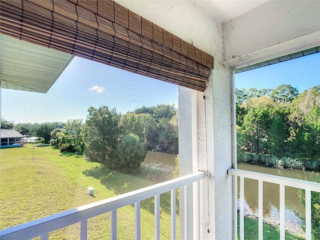 balcony featuring a water view