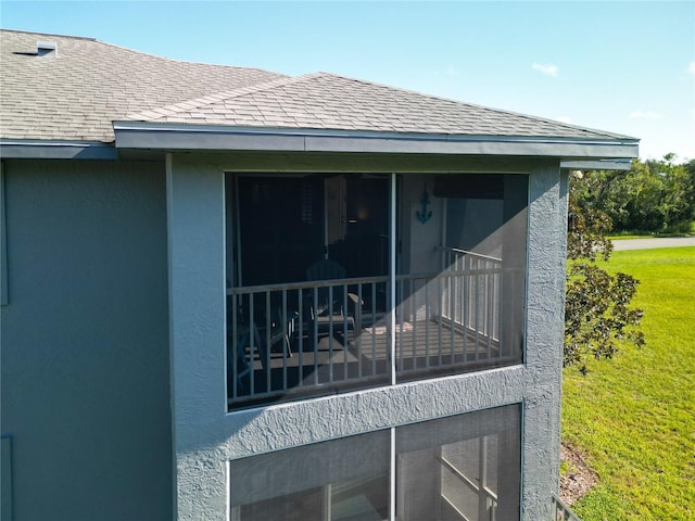 view of home's exterior with a lawn