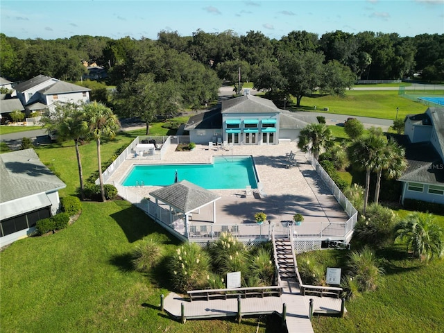 view of pool featuring a yard and a patio