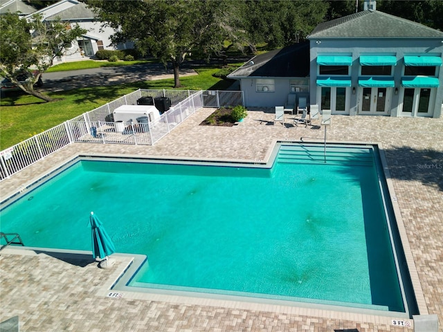 view of swimming pool featuring a patio area