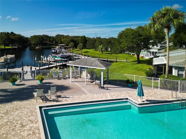 view of swimming pool with a water view