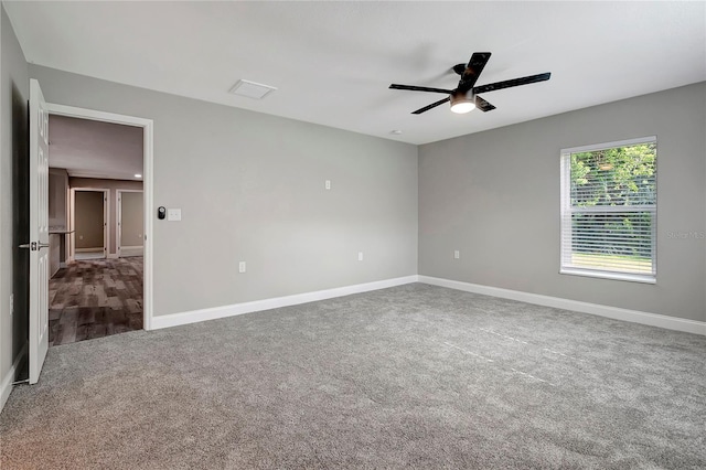 spare room featuring carpet and ceiling fan