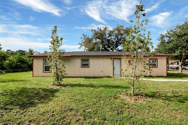 back of house with a yard