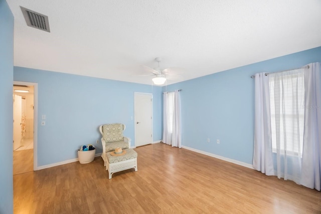 unfurnished room with ceiling fan and light hardwood / wood-style flooring