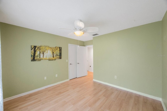 unfurnished room featuring ceiling fan and light hardwood / wood-style floors