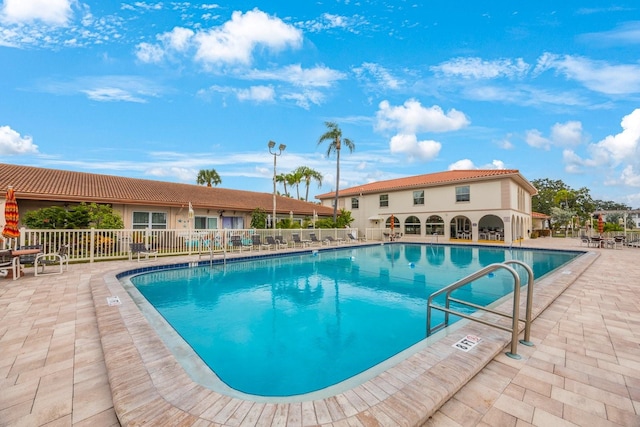 view of swimming pool featuring a patio area