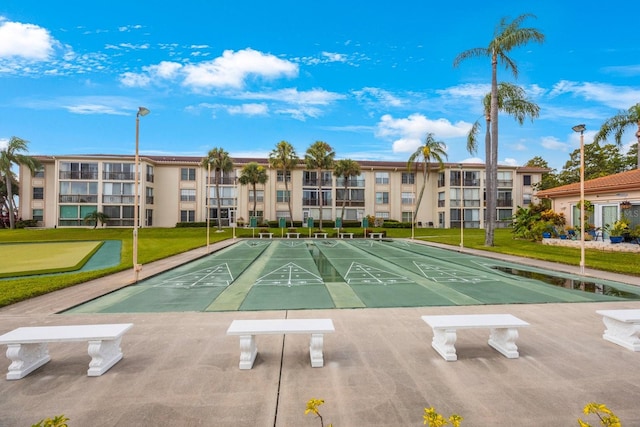 view of community featuring a yard