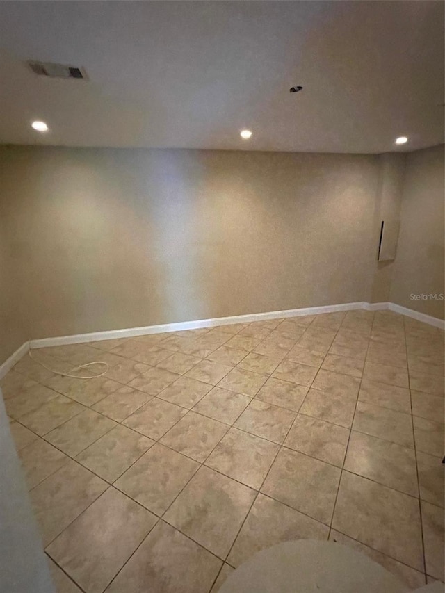 empty room with light tile patterned flooring