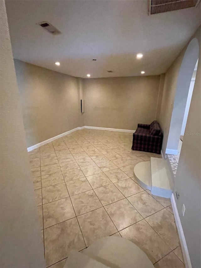 empty room with light tile patterned floors