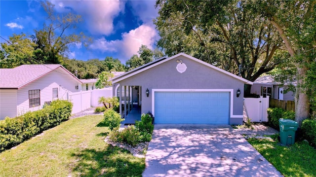 4477 67th St N, Saint Petersburg, FL 33709 - ranch-style home with stucco siding, a front yard, concrete driveway, and fence