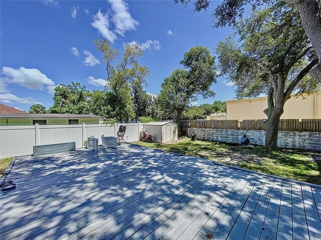 exterior space featuring a shed and a deck