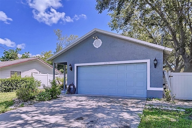 4477 67th St N, Saint Petersburg, FL 33709 - garage with fence and driveway