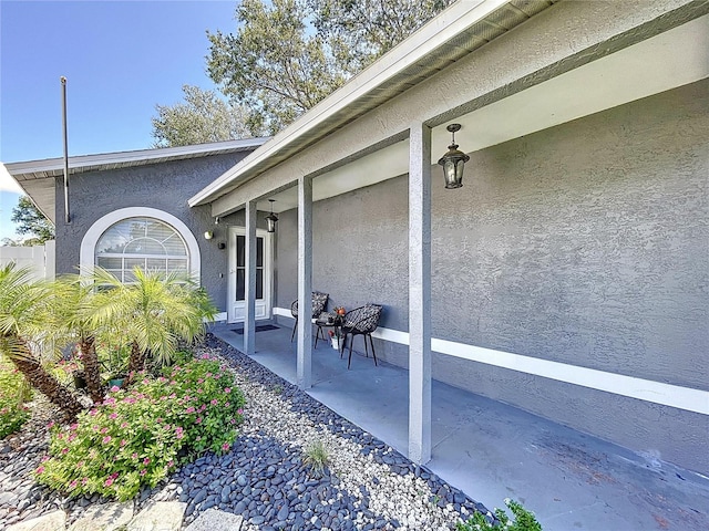 view of property exterior featuring a patio area