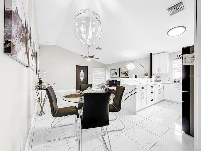 dining area with lofted ceiling and ceiling fan