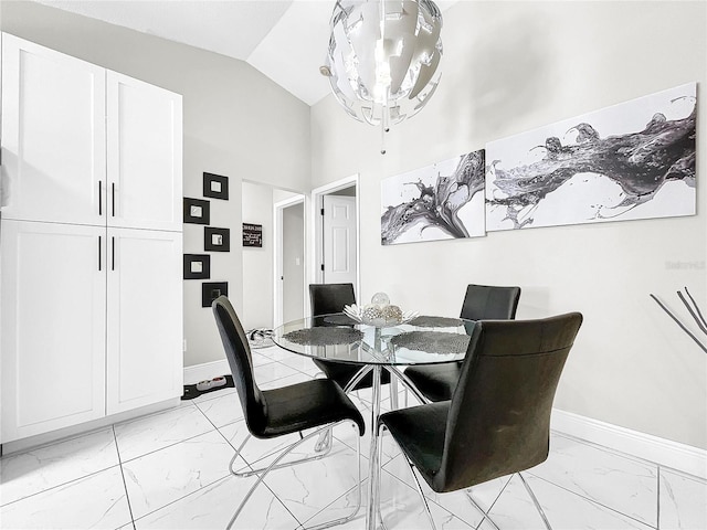 4477 67th St N, Saint Petersburg, FL 33709 - dining room featuring lofted ceiling, marble finish floor, baseboards, and a notable chandelier