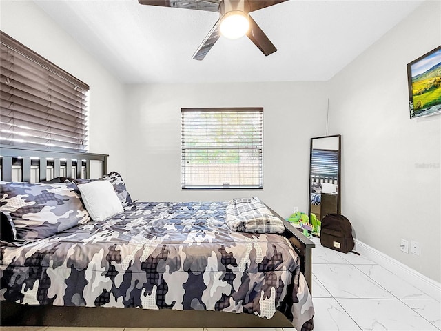 4477 67th St N, Saint Petersburg, FL 33709 - bedroom featuring marble finish floor, baseboards, and a ceiling fan