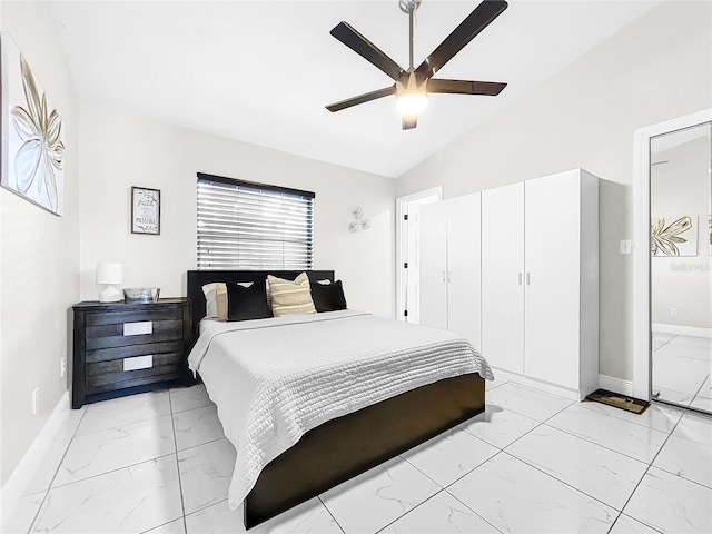 bedroom featuring vaulted ceiling, a closet, and ceiling fan