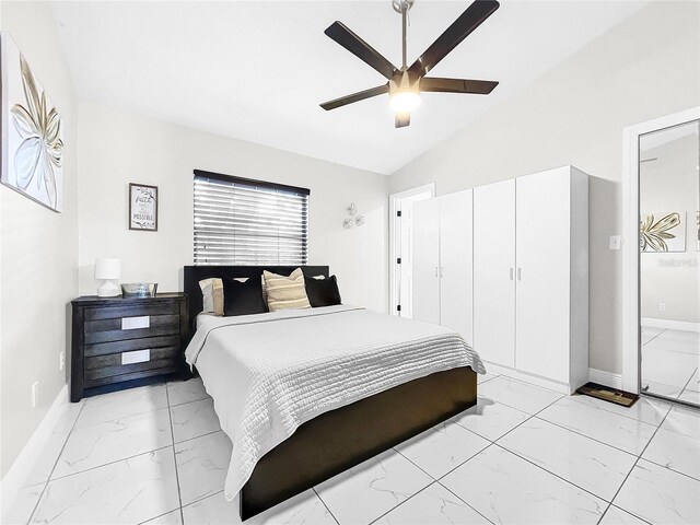 4477 67th St N, Saint Petersburg, FL 33709 - bedroom featuring vaulted ceiling, marble finish floor, baseboards, and ceiling fan