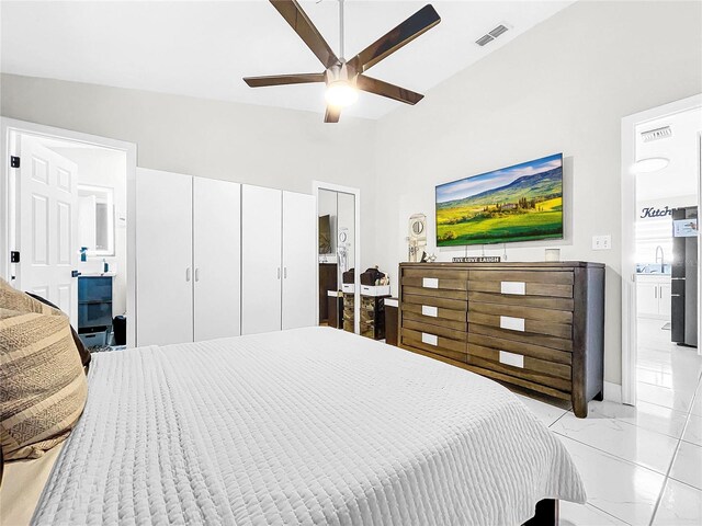 bedroom featuring vaulted ceiling, sink, and ceiling fan