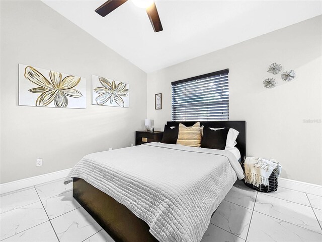 bedroom featuring ceiling fan and high vaulted ceiling