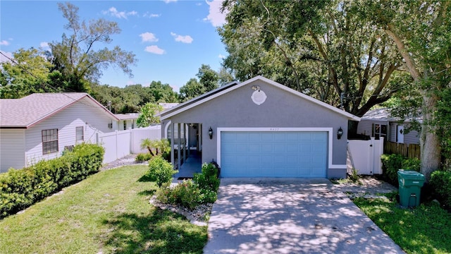 4477 67th St N, Saint Petersburg, FL 33709 - ranch-style house featuring stucco siding, a front lawn, fence, and driveway