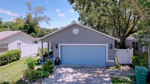 4477 67th St N, Saint Petersburg, FL 33709 - single story home featuring stucco siding, a front lawn, fence, and concrete driveway