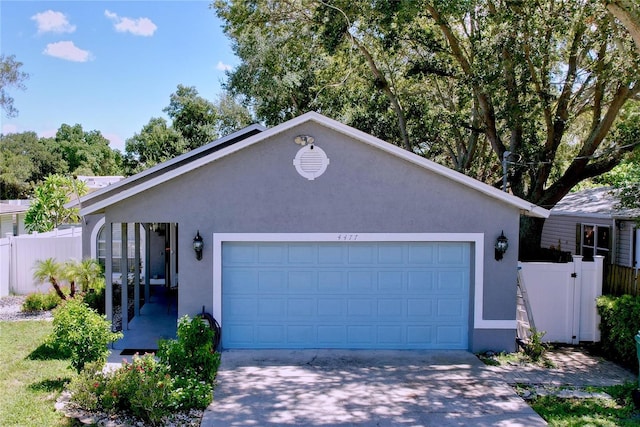 4477 67th St N, Saint Petersburg, FL 33709 - ranch-style home featuring stucco siding, fence, concrete driveway, and a garage