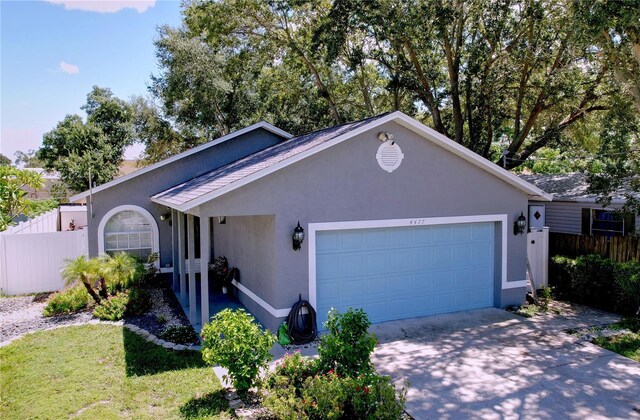 single story home featuring a garage