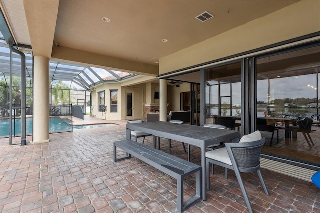 view of patio with a lanai