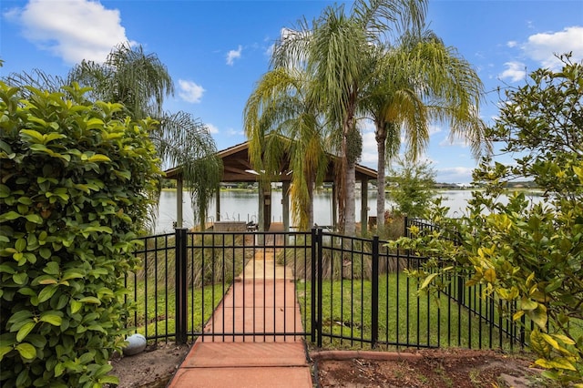 view of gate with a water view