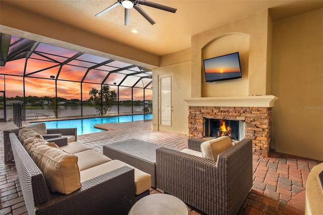 view of patio / terrace with an outdoor living space with a fireplace