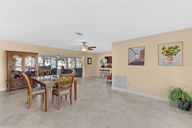 dining space featuring ceiling fan