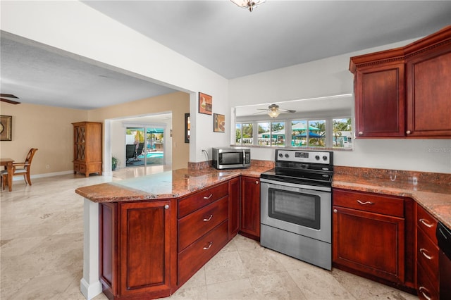 kitchen featuring kitchen peninsula, plenty of natural light, and stainless steel appliances