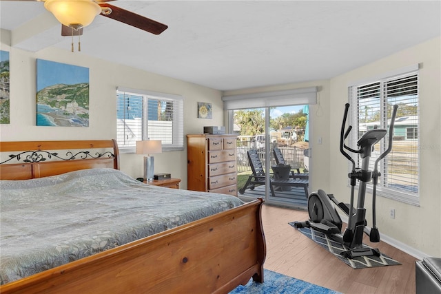 bedroom featuring access to exterior, ceiling fan, and hardwood / wood-style floors