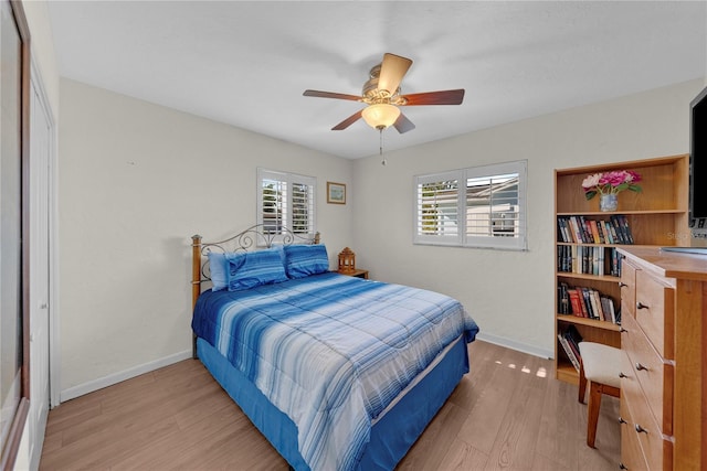 bedroom featuring ceiling fan and light hardwood / wood-style flooring