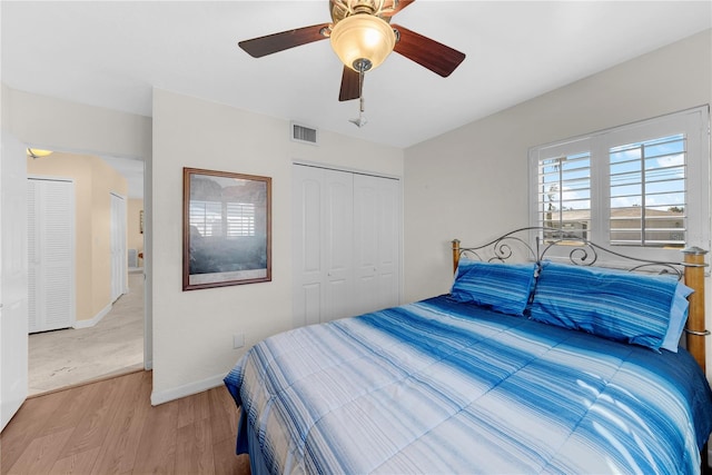 bedroom with ceiling fan and light hardwood / wood-style floors