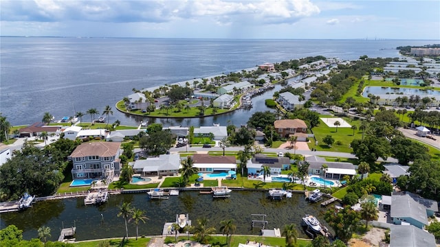 birds eye view of property featuring a water view