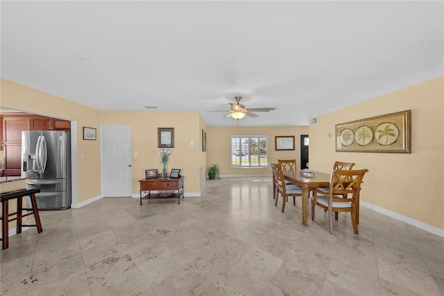 dining space featuring ceiling fan