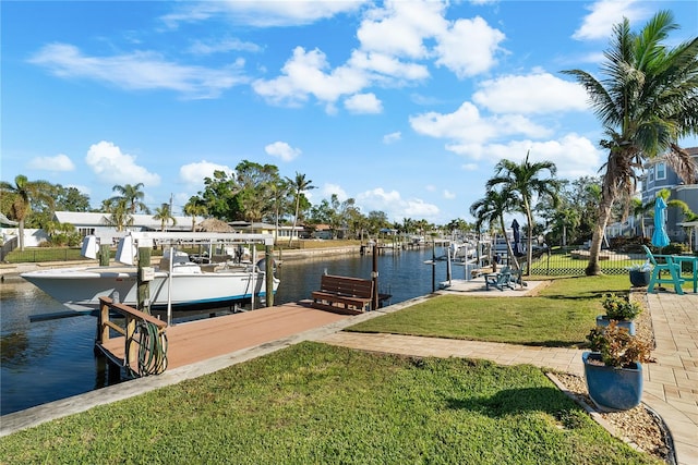 dock area featuring a yard and a water view