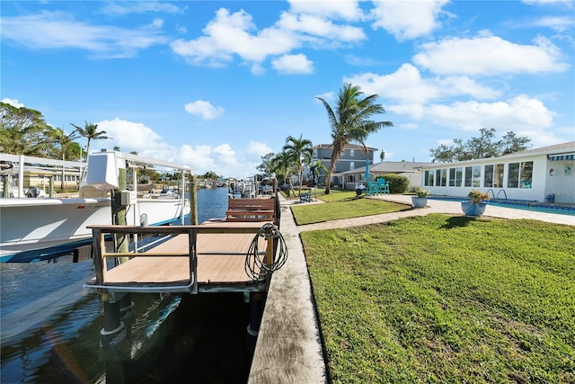 dock area featuring a yard and a water view