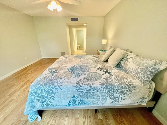 bedroom with ceiling fan and hardwood / wood-style floors