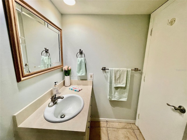 bathroom featuring tile patterned flooring and vanity