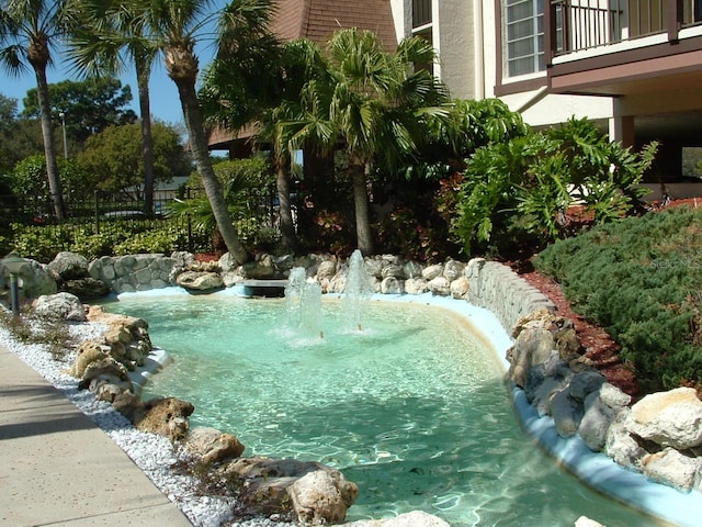 exterior space featuring a small pond